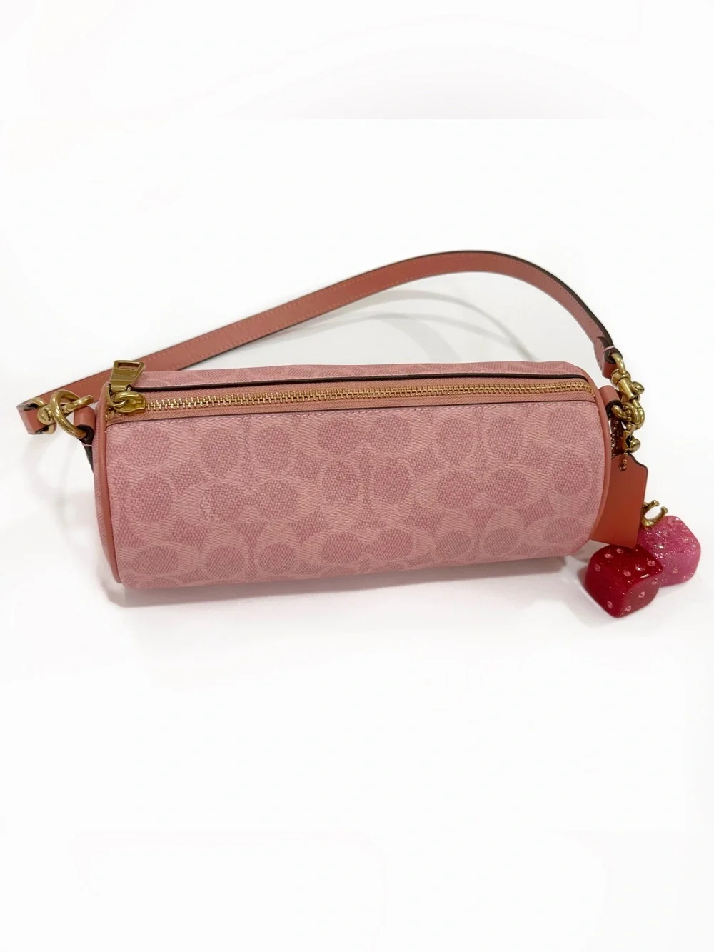 New Coach cylinder barrel bag in melon pink/ brass with signature canvas
